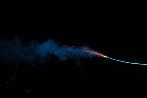 istock Burning fuse with sparks and blue smoke isolated on black background 891381080