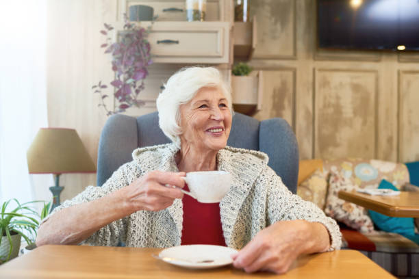 istock Happy Senior Lady Enjoying Tea 891382638