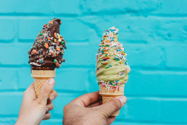 istock Holding ice cream against blue wall 891382692