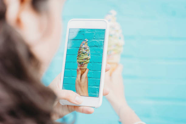 istock Photographing ice cream against blue wall 891382700