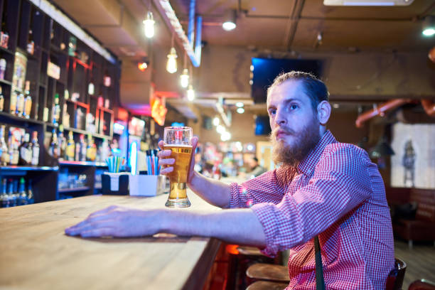 istock Contemporary  Young Man Chilling in Bar 891385114
