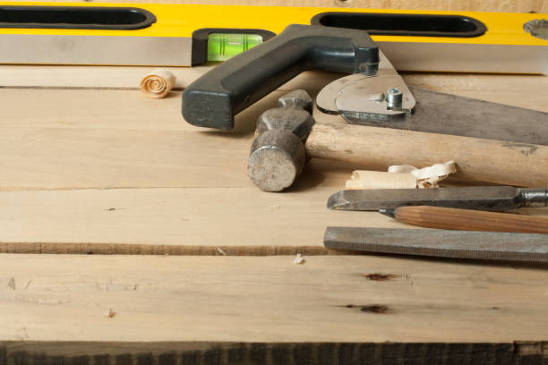 istock Carpentry concept.Joiner carpenter workplace. Construction tools, shavings and pencil on wooden table . 891386072
