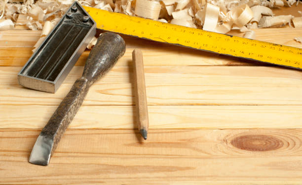 istock Carpentry concept.Joiner carpenter workplace. Construction tools on wooden table with shavings. Copy space for text. 891388396