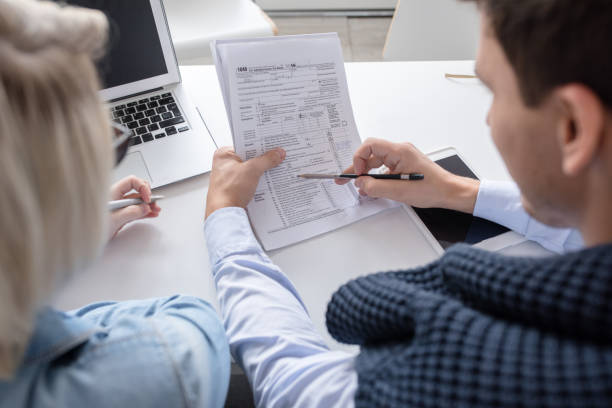 istock Business People Discussing Report in Meeting 891391162