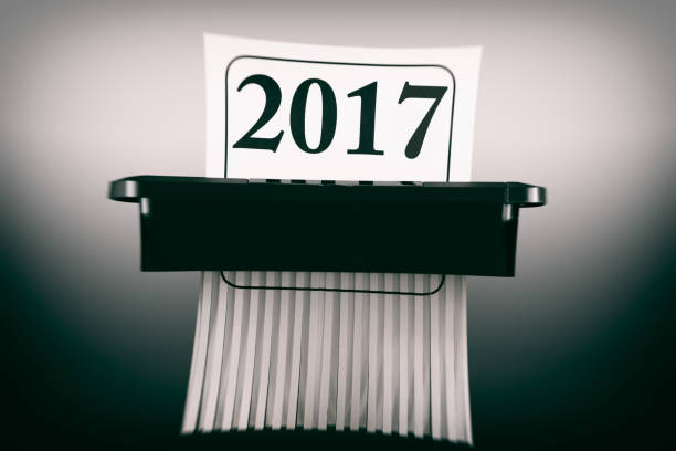 istock Destroying the Year 2017 in a Paper Shredder 891391604