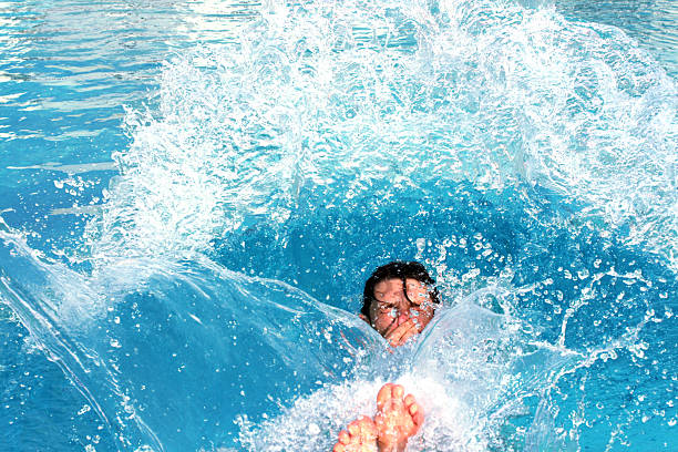 jump splashing pool stock photo