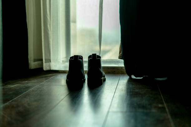 istock Suede shoes on floor 891404042