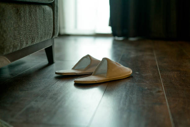 istock slippers on bedroom floor 891404044