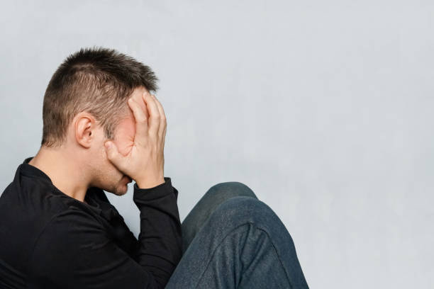 istock The depression man sit on the floor 891404246
