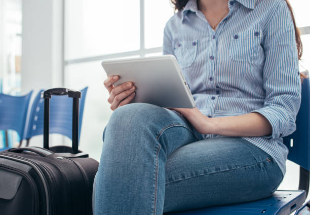 istock Woman connecting in the waiting room 891404718