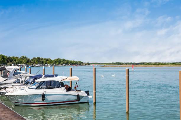 istock Boats moored in the lagoon harbor. 891407362