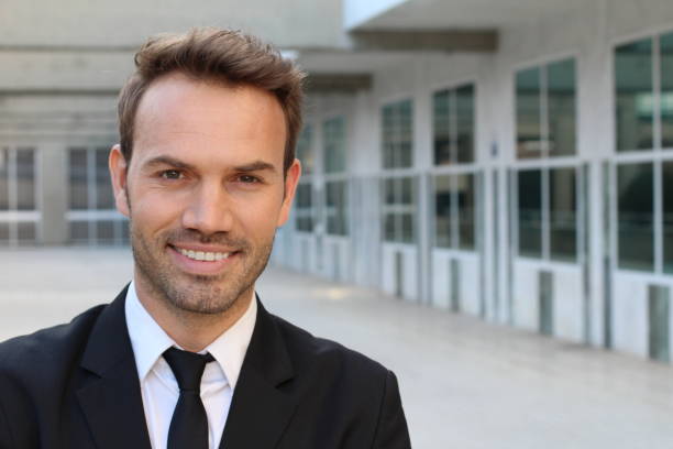 istock Businessman with straight white perfect teeth 891407922
