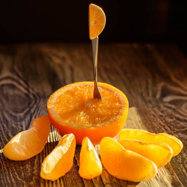 istock Ripe juicy fresh oranges, whole, cut and slices 891408290