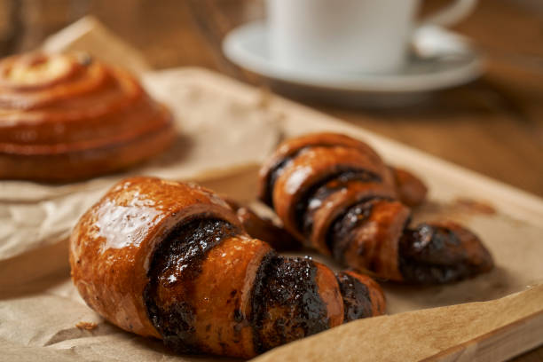 istock Freshly baked croissants and a cup of tea 891408618