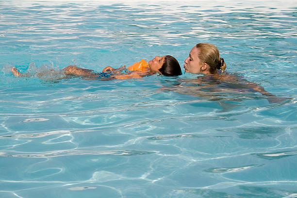 istock Boy and mom in the swimming pool 89141171