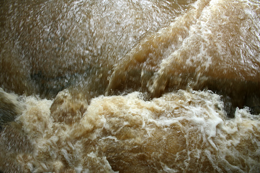 torrential rain turns a gentle stream in to a mud filled torrent