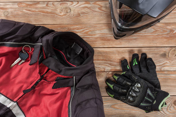 istock View of motorcycle rider accessories placed on rustic wooden table. 891416008