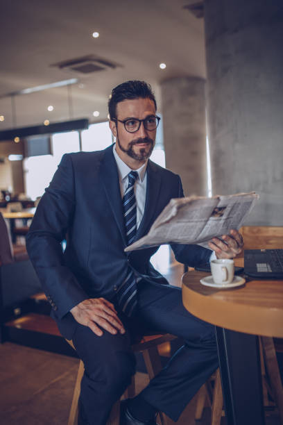 istock Businessman reading the news 891419228