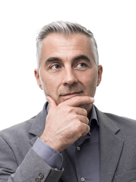 istock Smart businessman thinking with hand on chin 891419250