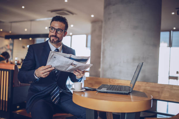 istock Gentleman reading the news 891419308
