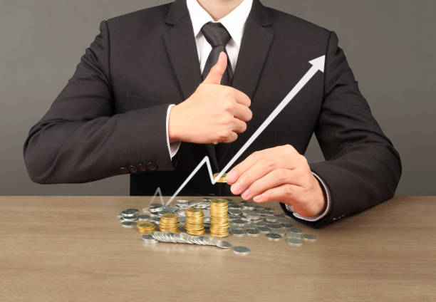 istock human hand putting coin to money 891422202