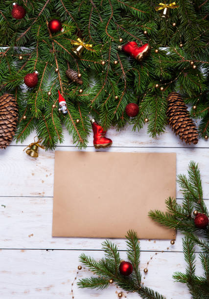 istock Christmas decoration on white wooden board 891422572