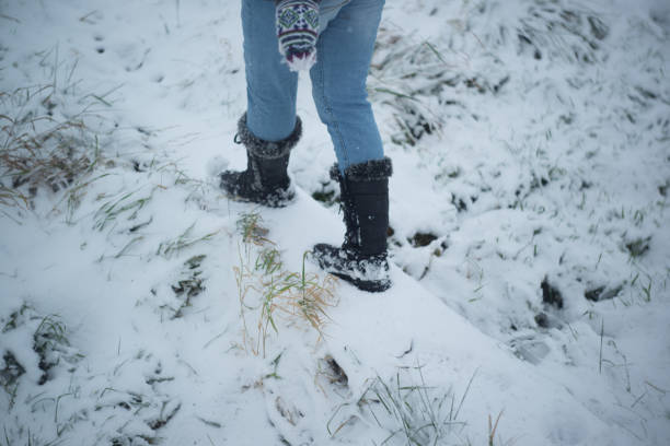 istock Girl walks in the snow 891422982