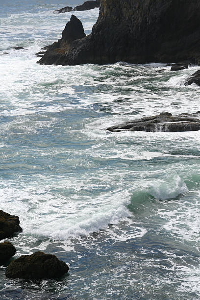 istock Incoming surf on rocky beach 89142493