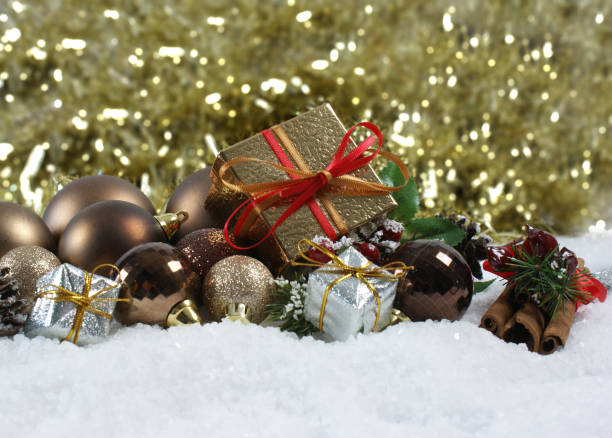 istock Christmas gift and decorations nestled in snow 891425338