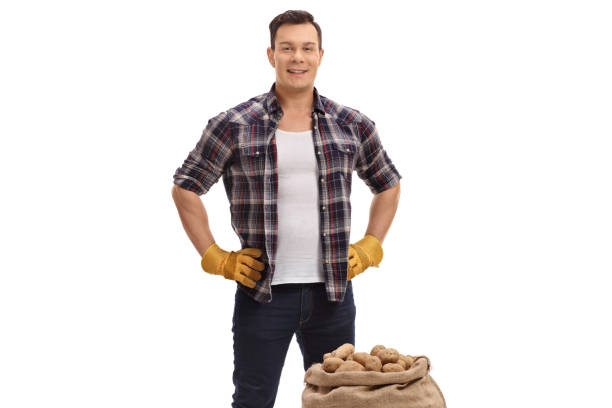 istock Farmer with a burlap sack filled with potatoes 891426222