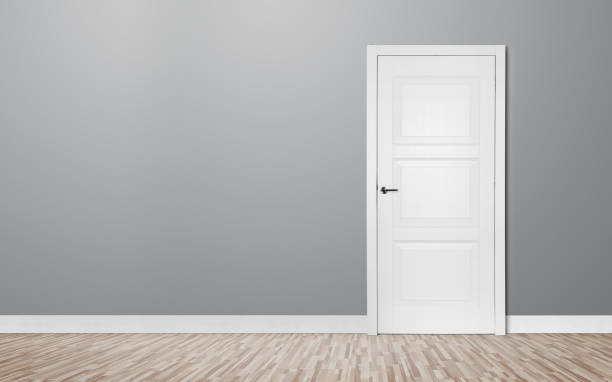 istock Closed door in the empty room 891426522