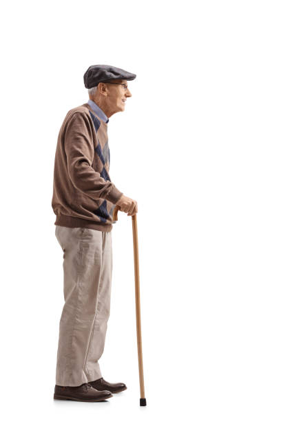 istock Senior with a cane waiting in line 891428756