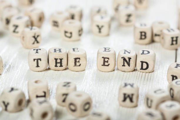 istock The End word written on wood block. 891429496