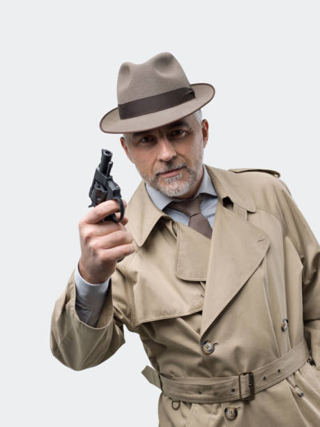 istock Retro spy agent with revolver 891430032