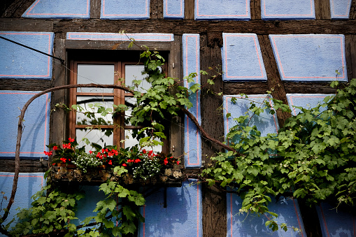 window with shutters on traditional woodhouse in Switzerland