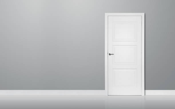 istock Closed door in the empty room 891433704