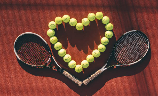 istock Balls and racket on tennis court. 891437670