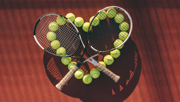 istock Balls and racket on tennis court. 891437702