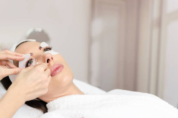 istock Anti aging treatment on middle aged female face 891441614