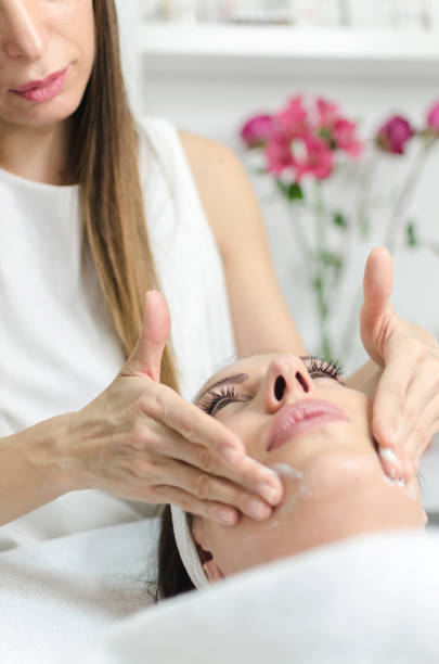 istock Mild face massage with vitamin cream 891441708
