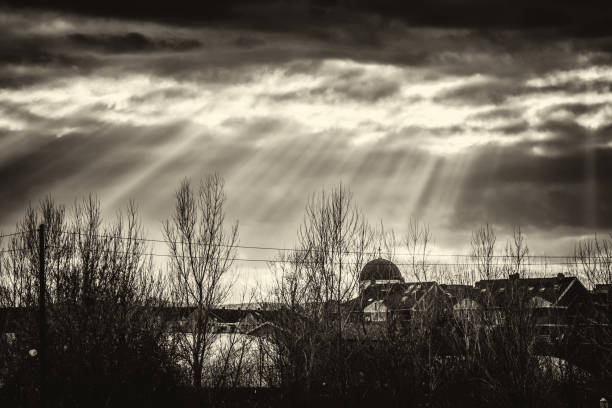 magical rays through the clouds to the houses