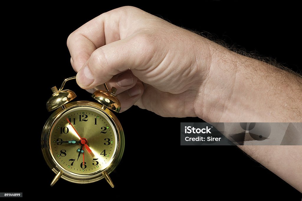 Alarm clock in a hand 2  Alarm Clock Stock Photo