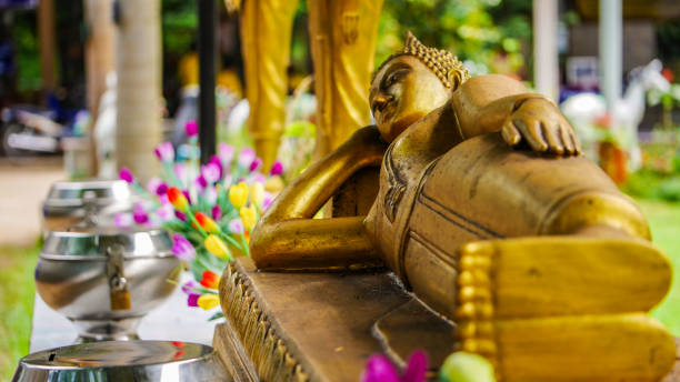 istock golden reclining buddha image , Put the head on a triangle pillow. Put one hand on the hips , and the other arm under the head. 891452590