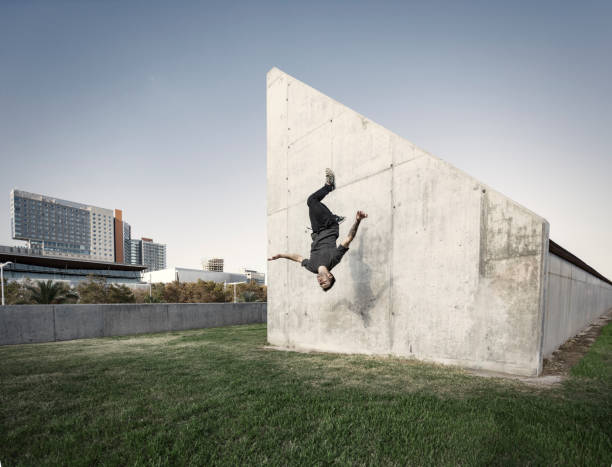 Man jumping and practicing parkour in the city