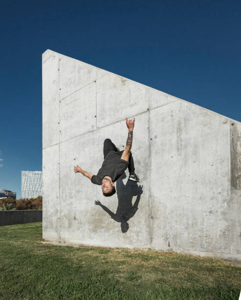 istock Man jumping and practicing parkour in the city 891453128