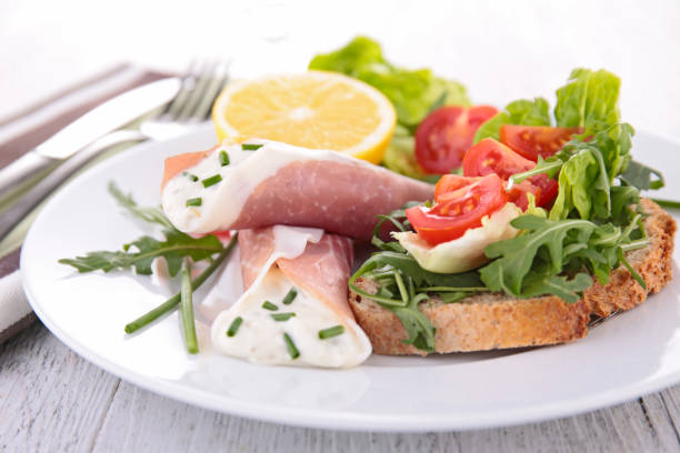 istock bruschetta with rocket and tomato and ham with cheese 891464178