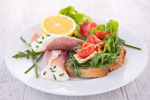 istock bruschetta with rocket and tomato and ham with cheese 891464394