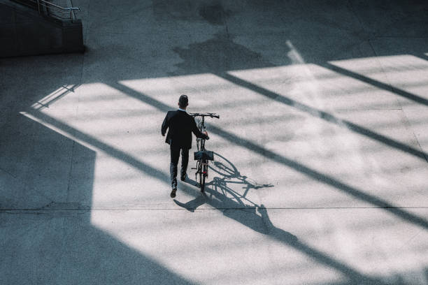 istock overhead view on Businessman with bicycle 891471534