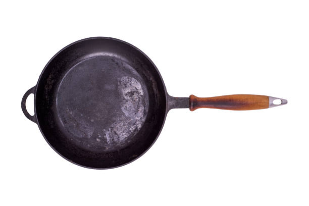 istock old black round cast-iron frying pa 891473658