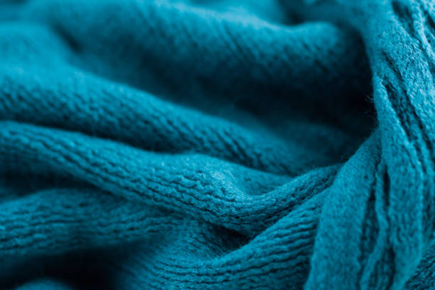istock The texture of a cozy warm blue scarf 891484032